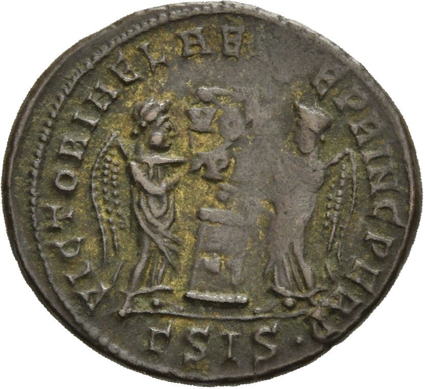 RIC VII Siscia 59 Constantine I reverse, Two Victories, winged, draped, facing each other, holding a shield inscribed VOT/...