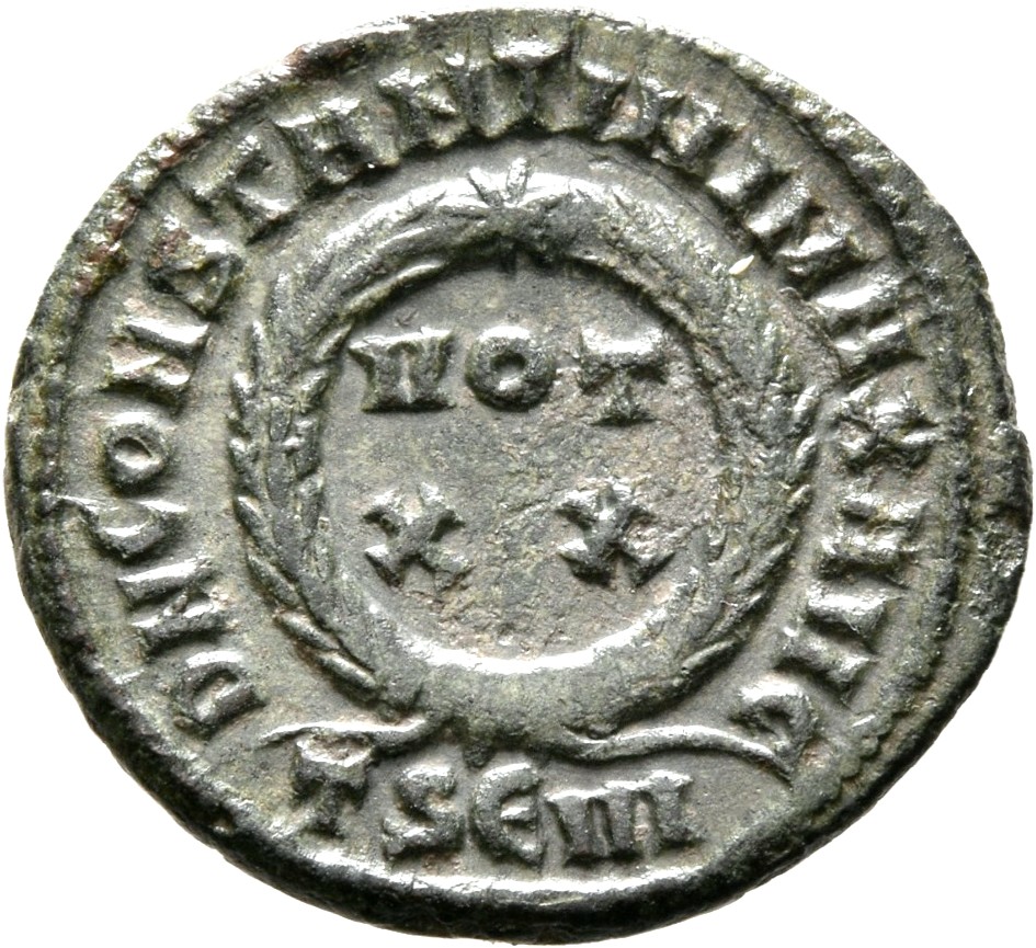 RIC VII Thessalonica 117 Constantine I reverse — VOT/XX within a laurel wreath