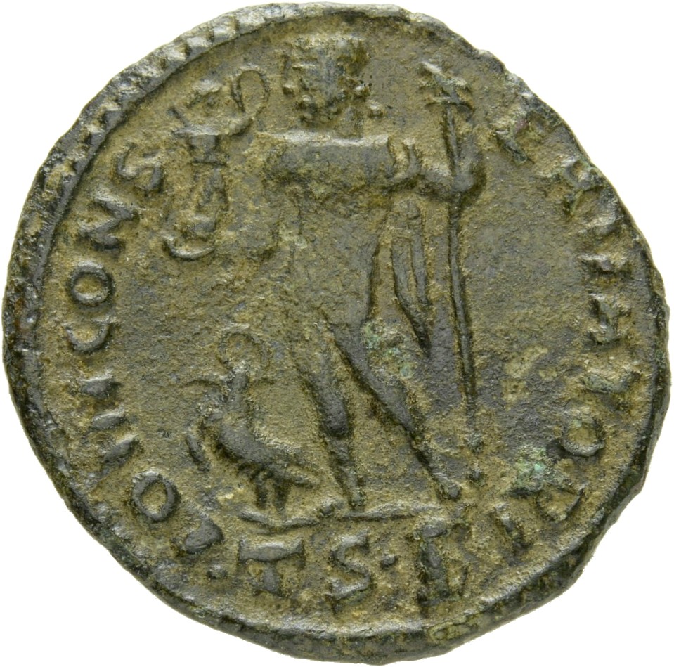 Constantine I reverse — Jupiter, nude, chlamys draped across left shoulder, standing left, holding Victory on globe in right hand and leaning on sceptre with left hand; to left, eagle with wreath
