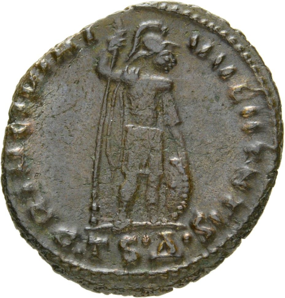 Constantine I reverse — Crispus, draped, cuirassed, cloak spread, standing right, placing right hand on shield and holding reversed spear in left hand