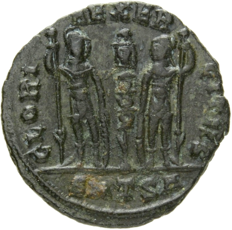 Constantine I reverse — Two soldiers, helmeted, draped, cuirassed, standing facing each other, each holding reversed spear in outer hand and resting inner hand on shield; between them, one standard