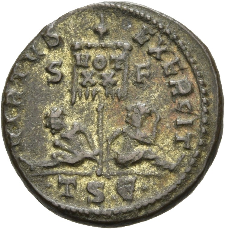 RIC VII Thessalonica 75 Constantine I reverse, Standard inscribed VOT/XX flanked by two seated captives