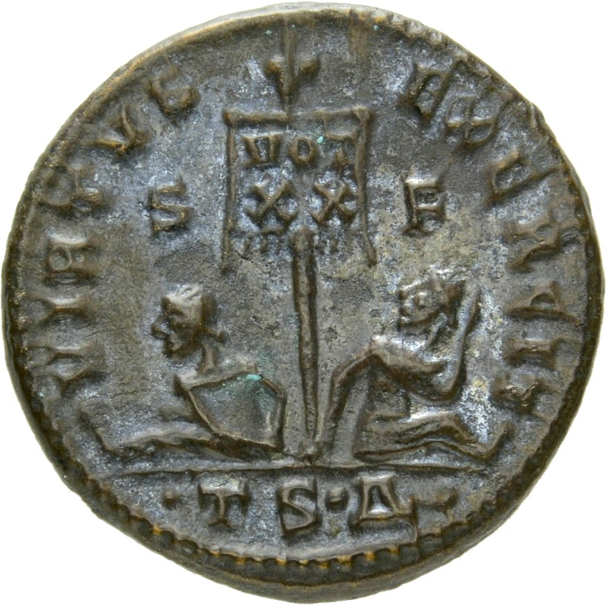 RIC VII Thessalonica 77 Constantine I reverse, Standard inscribed VOT/XX flanked by two seated captives