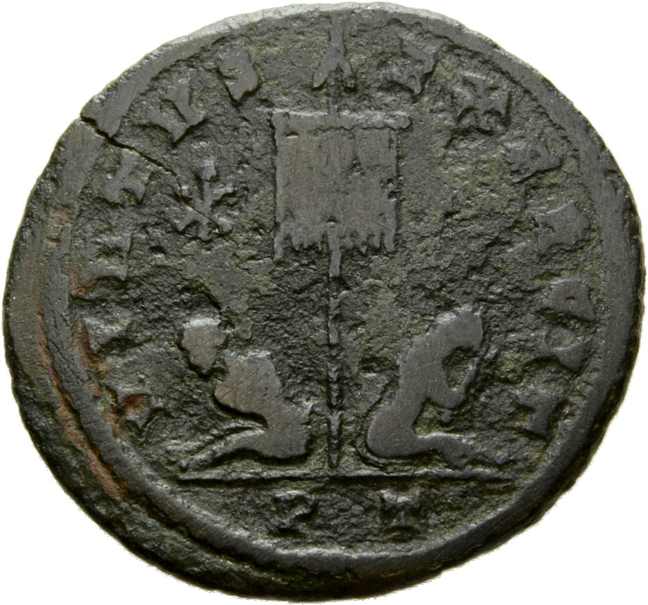 RIC VII Ticinum 121 Constantine I reverse, Standard with VOT/XX inscribed on drapery, flanked by two seated captives