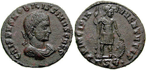 RIC VII Ticinum 20 Constantine I reverse, Sol, radiate, chlamys draped across left shoulder, standing left, raising right ...