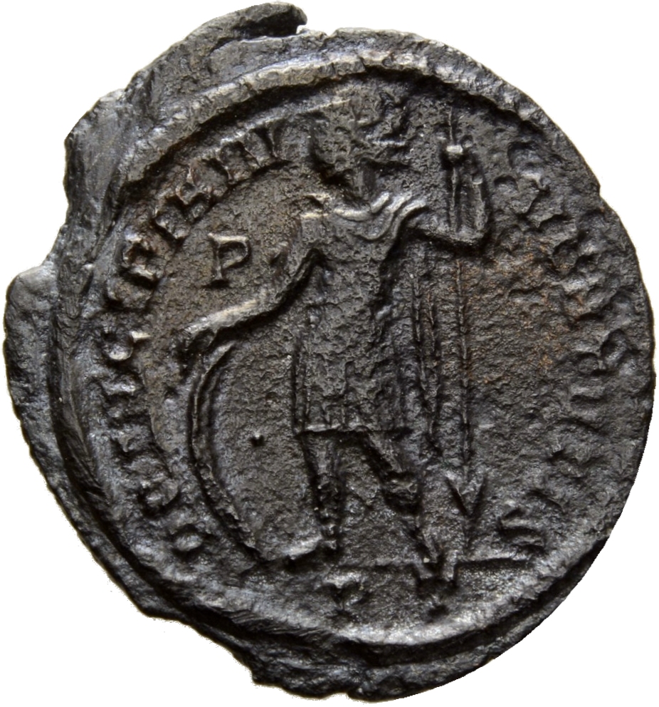 Constantine I reverse — Crispus, helmeted, draped, cuirassed, chlamys draped across left shoulder, standing left, placing right hand on shield and holding reversed spear in left hand