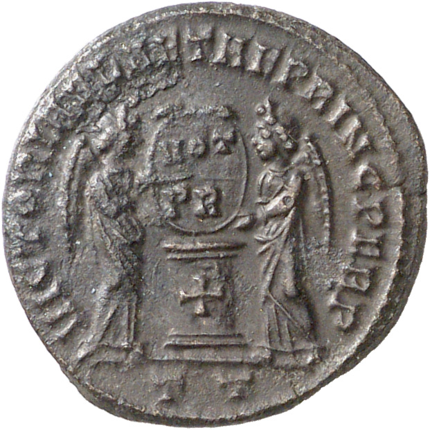 RIC VII Ticinum 86 Constantine I reverse, Two Victories, winged, draped, facing each other, holding a shield inscribed VOT...