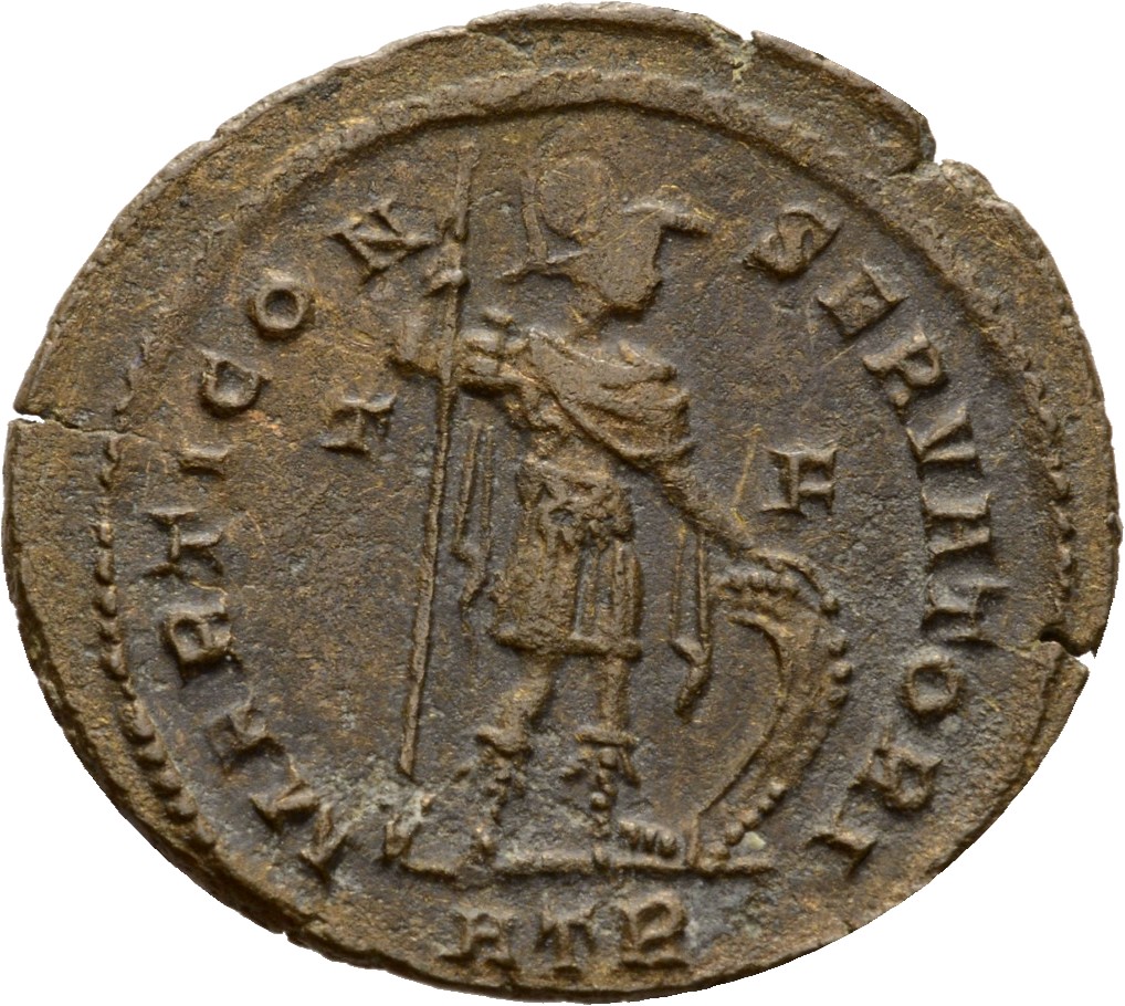 Constantine I reverse — Mars, helmeted, draped, cuirassed, cloak spread, standing right, holding reversed vertical spear in right hand and resting left hand on shield