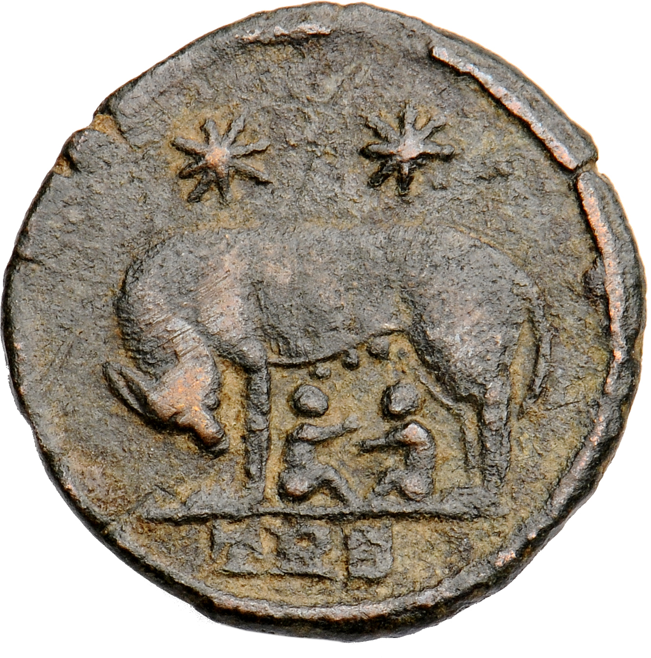 RIC VII Treveri 522 Constantine I reverse, She-wolf, standing left, suckling twins; above, two stars