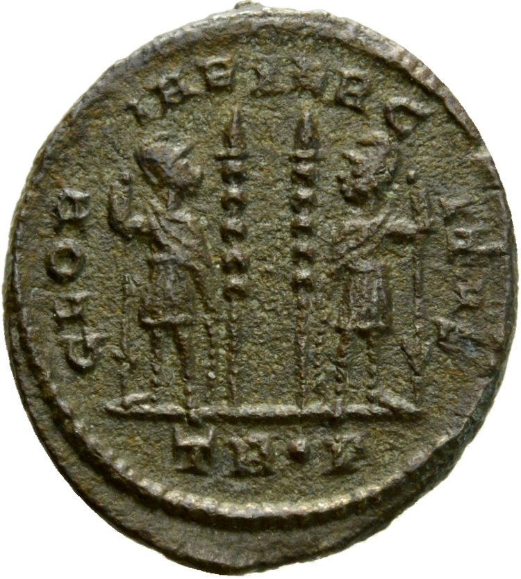 RIC VII Treveri 539 Constantine I reverse, Two soldiers, helmeted, draped, cuirassed, standing facing each other, each hol...