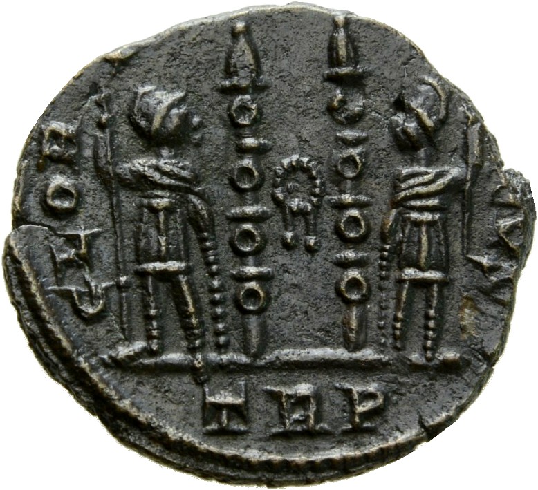 RIC VII Treveri 552 Constantine I reverse, Two soldiers, helmeted, draped, cuirassed, standing facing each other, each hol...