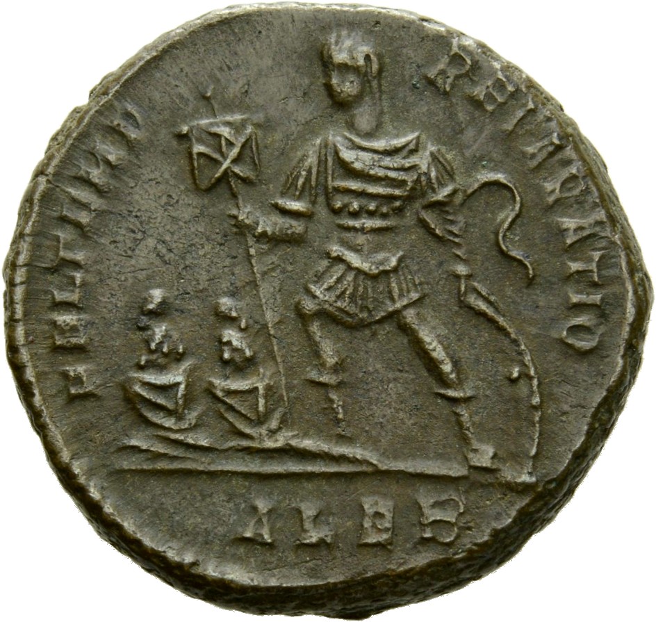 RIC VIII Alexandria 55 Constantius II reverse — Constantius II, draped, cuirassed, standing left, holding standard in righ...