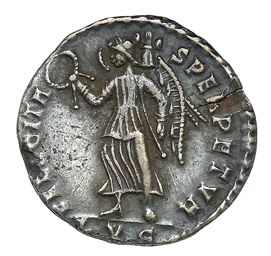 RIC VIII Lugdunum 120 Magnentius reverse, Victory, winged, draped, walking left, holding wreath in right hand and trophy i...
