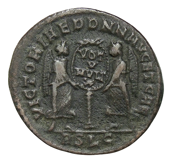 RIC VIII Lugdunum 122 Magnentius reverse, Two Victories, winged, draped, standing facing each other, holding between them ...