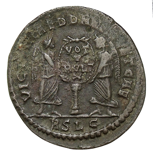 RIC VIII Lugdunum 122 Magnentius reverse, Two Victories, winged, draped, standing facing each other, holding between them ...