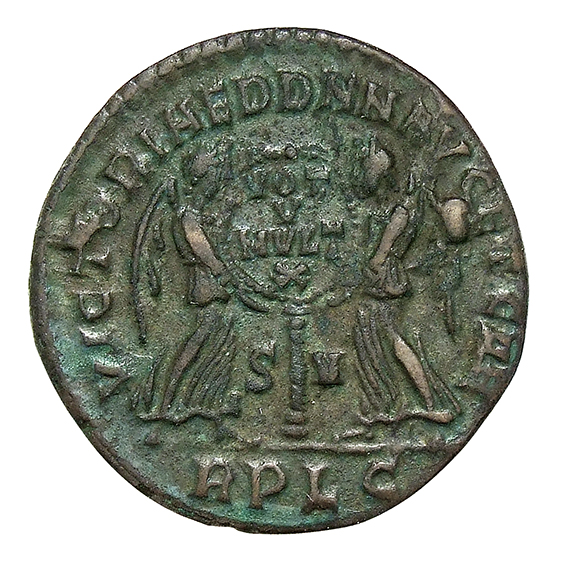 RIC VIII Lugdunum 123 Magnentius reverse, Two Victories, winged, draped, standing facing each other, holding between them ...