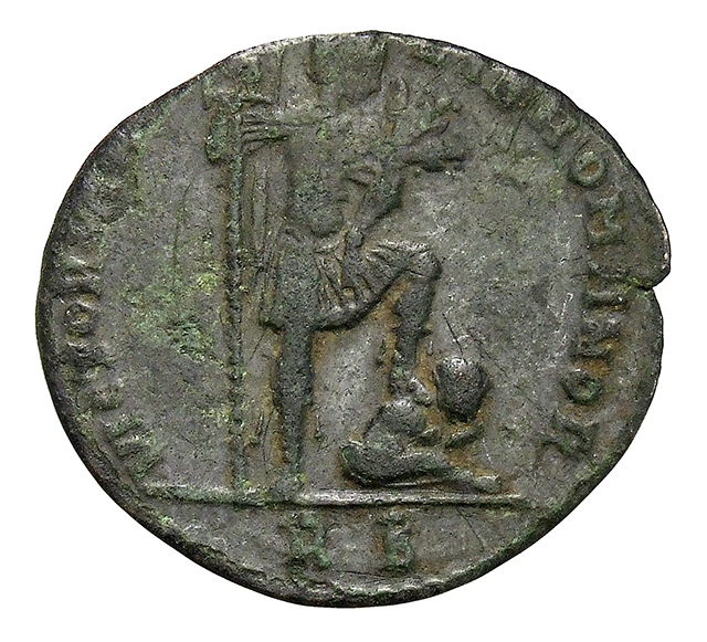 RIC VIII Rome 177 Magnentius reverse, Magnentius, draped, cuirassed, standing right, holding standard with eagle on banner...