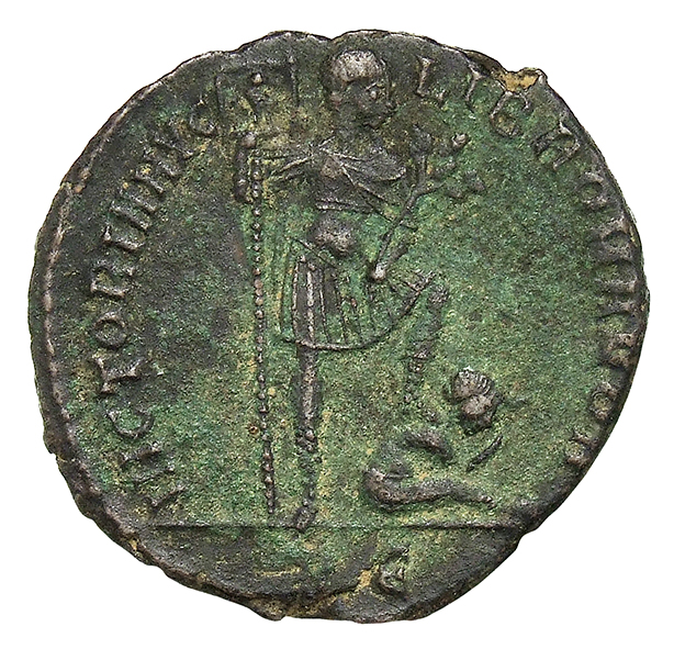 RIC VIII Rome 177 Magnentius reverse, Magnentius, draped, cuirassed, standing right, holding standard with eagle on banner...
