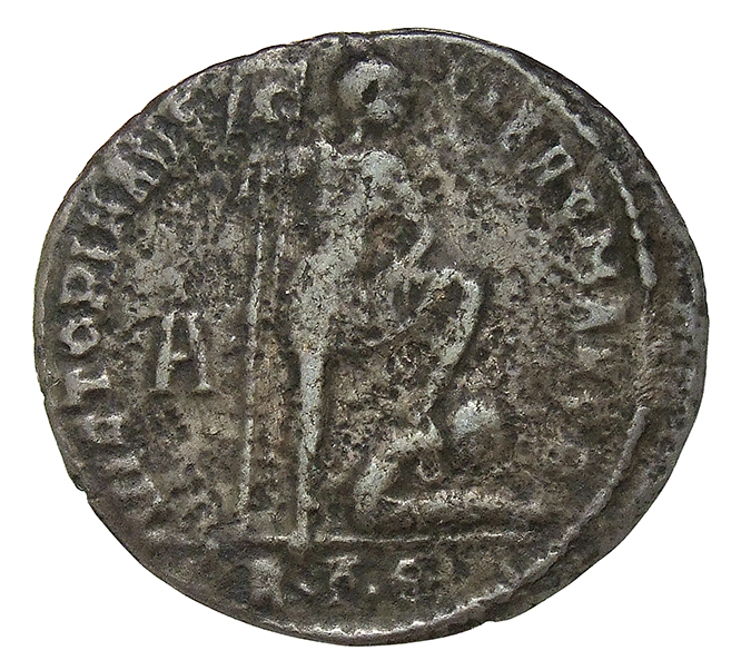 RIC VIII Rome 179 Magnentius reverse, Magnentius, draped, cuirassed, standing right, holding standard with eagle on banner...