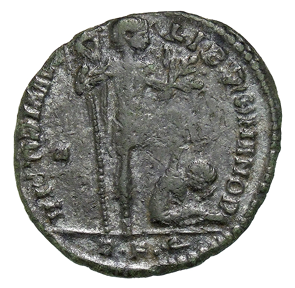 RIC VIII Rome 179 Magnentius reverse, Magnentius, draped, cuirassed, standing right, holding standard with eagle on banner...