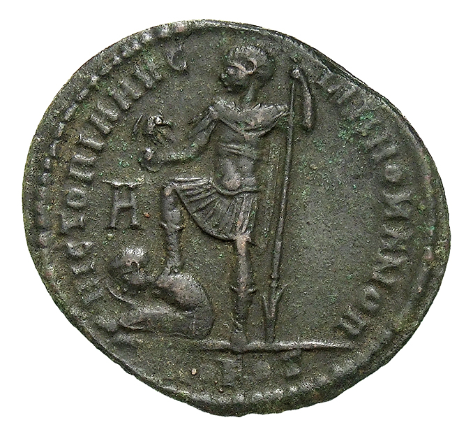 RIC VIII Rome 180 Magnentius reverse, Magnentius, draped, cuirassed, standing left, holding globe surmounted by eagle on b...