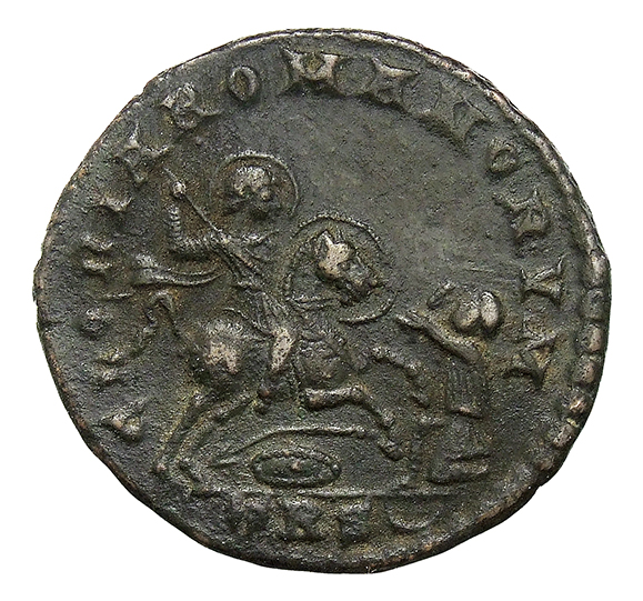 RIC VIII Treveri 271 Magnentius reverse, Magnentius, draped, cuirassed, galloping right, spearing kneeling barbarian with ...