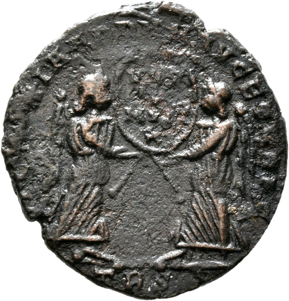 RIC VIII Treveri 313 Magnentius reverse, Two Victories, winged, draped, facing each other, holding between them a wreath i...